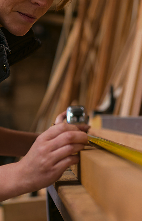 female carpenter working in woodwork workshop