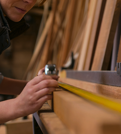 female carpenter working in woodwork workshop