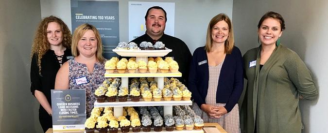 NSB staff with branded cupcakes 